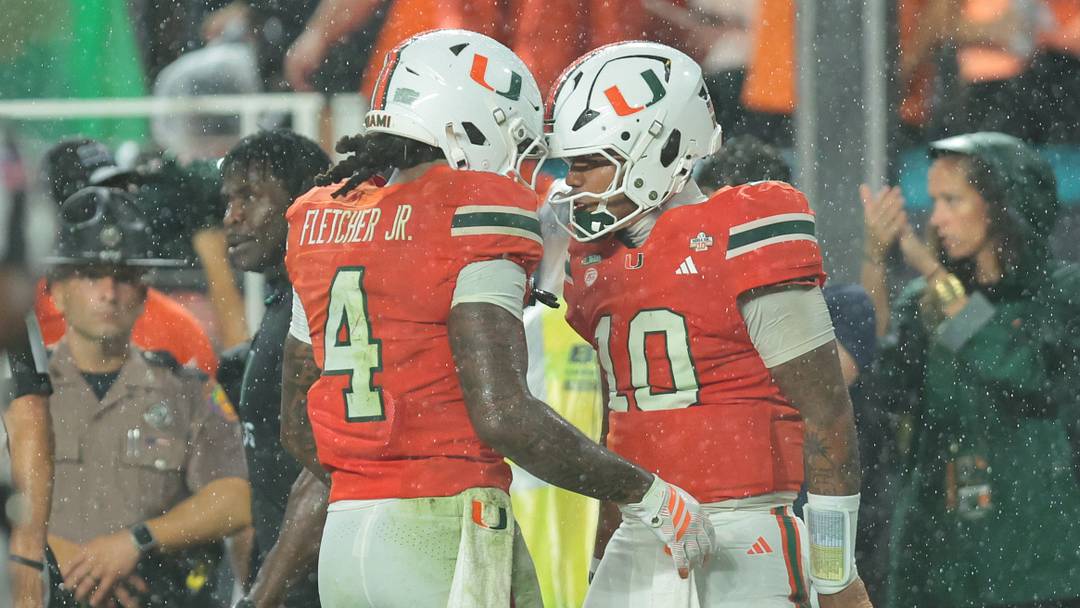 Oct 17, 2026; Miami Gardens, Florida, USA;  Miami Hurricanes running back Mark Fletcher Jr. (4) celebrates with quarterback Darian Mensah (10) after a touchdown during the first quarter against the Florida State Seminoles at Hard Rock Stadium.  Mandatory Credit: Sam Navarro-Imagn Images