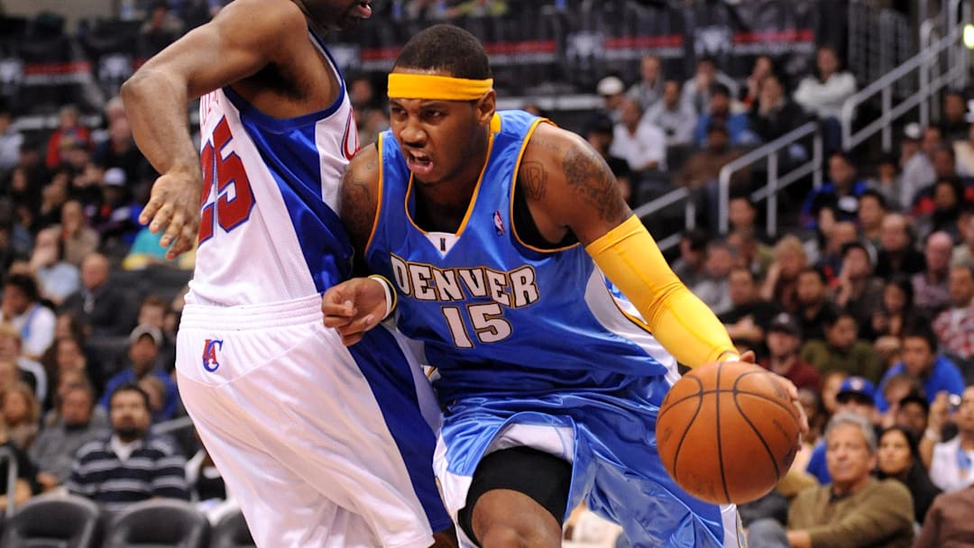 Nov 26, 2008; Los Angeles, CA, USA; Denver Nuggets forward Carmelo Anthony (15) dribbles past Los Angeles Clippers guard Mardy Collins (25) at the Staples Center. The Nuggets defeated the Clippers 106-105. Mandatory Credit: Kirby Lee/Image of Sport-Imagn Images