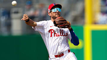 Philadelphia Phillies shortstop Trea Turner (7) throws to first base against the New York Yankees in the third inning during spring training at BayCare Ballpark.