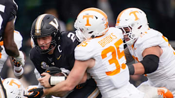 Tennessee defensive back Will Brooks (35) stops Vanderbilt quarterback Diego Pavia (2) during the second quarter at FirstBank Stadium in Nashville, Tenn., Saturday, Nov. 30, 2024.