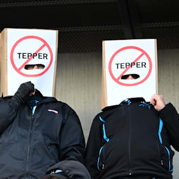 Jan 7, 2024; Charlotte, North Carolina, USA; Carolina Panthers fans Alex Alday, John Alday, and Jon Yonke of Charlotte express their displeasure with Panthers owner David Tepper at Bank of America Stadium.