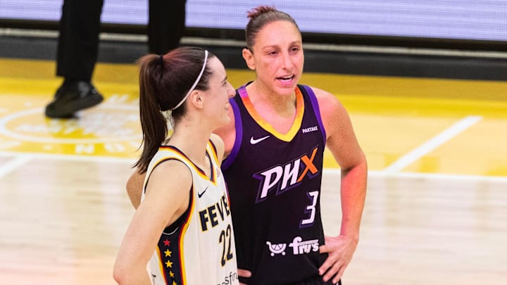 Indiana Fever guard Caitlin Clark (22) and Phoenix Mercury guard Diana Taurasi (3) talk at half court during a free throw on June 30, 2024, at Footprint Center in Phoenix. Indiana Fever guard Caitlin Clark (22) and Phoenix Mercury guard Diana Taurasi (3) talk at half court during a free throw on June 30, 2024, at Footprint Center in Phoenix.