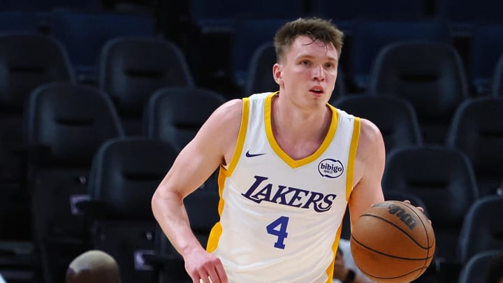 Jul 10, 2024; San Francisco, CA, USA; Los Angeles Lakers guard Dalton Knecht (4) controls the ball against the Miami Heat during the third quarter at Chase Center. Mandatory Credit: Kelley L Cox-USA TODAY Sports