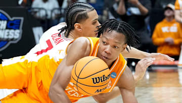 Tennessee Volunteers guard Jordan Gainey (11) and Houston Cougars guard Milos Uzan (7) battle for control of the ball during the second half of a game Sunday, March 30, 2025, during the Elite Eight round of the NCAA March Madness tournament at Lucas Oil Stadium in Indianapolis. Houston defeated Tennessee 69-50.