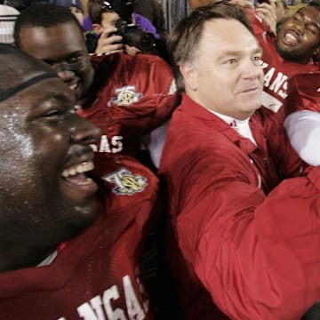 Arkansas Razorbacks head coach Houston Nutt celebrates with his team after their 50-48 triple overtime victory over the top ranked LSU Tigers at Tiger Stadium. 