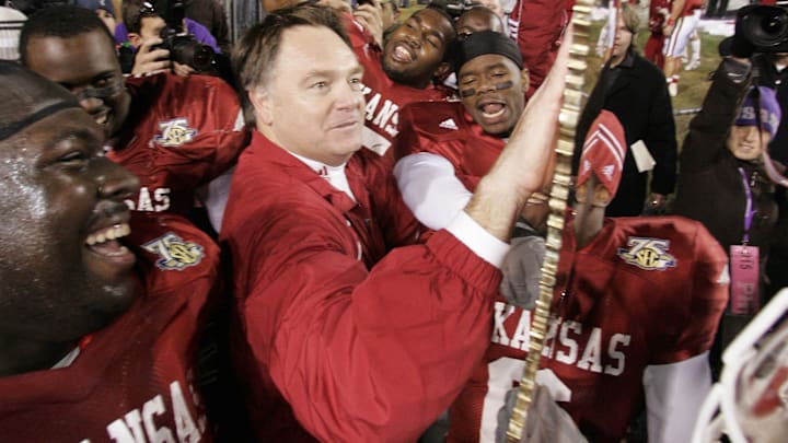 Arkansas Razorbacks head coach Houston Nutt celebrates with his team after their 50-48 triple overtime victory over the top ranked LSU Tigers at Tiger Stadium. 