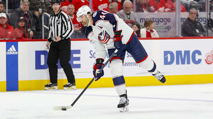 Mar 19, 2024; Detroit, Michigan, USA; Columbus Blue Jackets defenseman Erik Gudbranson (44) shoots the puck during the first period of the game against the Detroit Red Wings at Little Caesars Arena. Mandatory Credit: Brian Bradshaw Sevald-Imagn Images