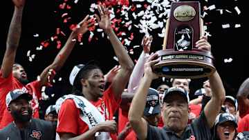 Houston coach Kelvin Sampson holds up the Midwest Regional championship trophy after the Cougars' win against Tennessee on March 30, 2025.