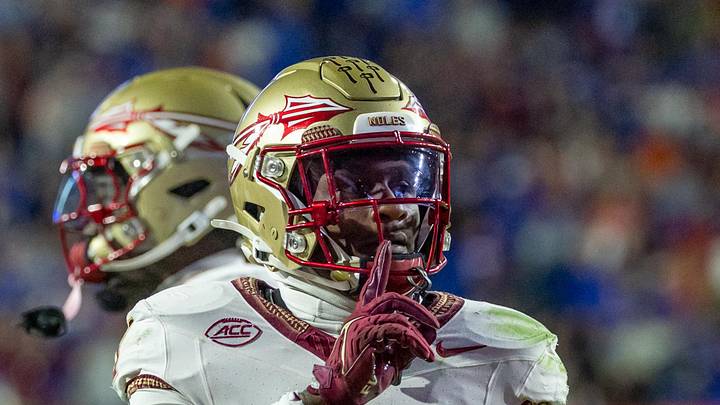 Nov 29, 2025; Gainesville, Florida, USA; Florida State Seminoles defensive back Edwin Joseph (3) silences the crowd after an interception during the second quarter against the Florida Gators at Ben Hill Griffin Stadium. Mandatory Credit: Bob Kupbens-Imagn Images