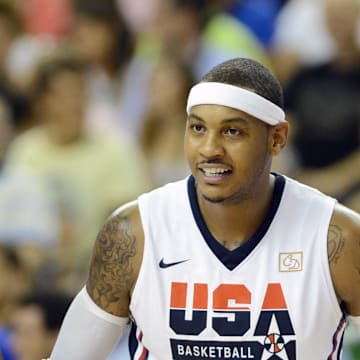 July 22, 2012; Barcelona, SPAIN; USA guard Kevin Durant (5) talks with teammate Carmelo Anthony (right) during the second half of an exhibition game against Argentina in preparation for the 2012 London Olympic Games at Palau Sant Jordi. 