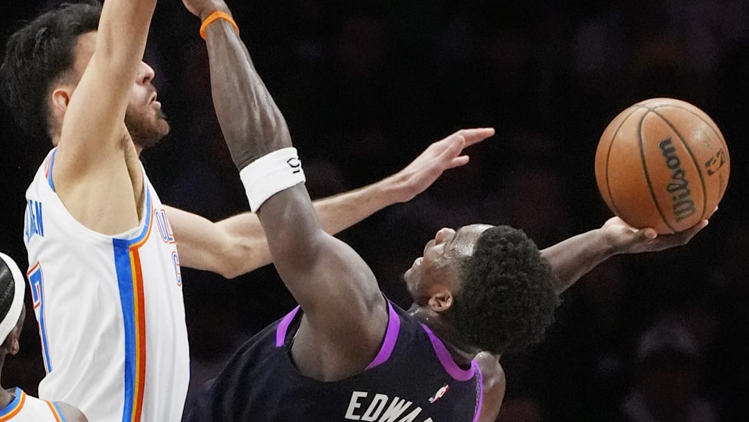 Dec 19, 2025; Minneapolis, Minnesota, USA; Minnesota Timberwolves guard Anthony Edwards (5) goes to the basket against Oklahoma City Thunder center Chet Holmgren (7) in the first quarter at Target Center. Mandatory Credit: Bruce Kluckhohn-Imagn Images