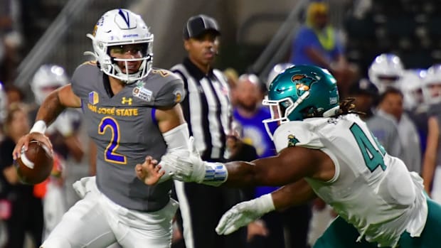San Jose State quarterback Chevan Cordeiro (2) scrambles away from Coastal Carolina defensive lineman Will Whitson (44)