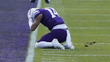 Nov 4, 2023; Chicago, Illinois, USA; Northwestern Wildcats wide receiver Cam Johnson (14) after missing a pass agains the Iowa Hawkeyes during the first half at Wrigley Field. Mandatory Credit: David Banks-Imagn Images