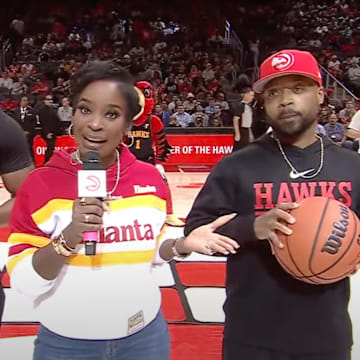 Hawks in-game host Shamea Morton and two fans before a tragic event.