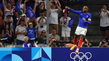 Alexandre Lacazette of France celebrates scoring their first goal against USA during a men's Group A football match during the Paris 2024 Olympic Summer Games at Orange Velodrome.