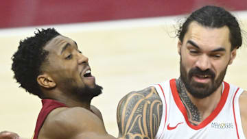 Cleveland Cavaliers guard Donovan Mitchell defends Houston Rockets center Steven Adams.