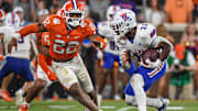 Sep 17, 2022; Clemson, South Carolina, USA; Clemson Tigers linebacker Trenton Simpson (22) runs down Louisiana Tech Bulldogs running back Marquis Crosby (33) during the fourth quarter at Memorial Stadium. Mandatory Credit: Ken Ruinard-Imagn Images