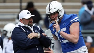 Penn State Nittany Lions quarterback Drew Allar (15) listens to offensive coordinator Andy Kotelnicki 