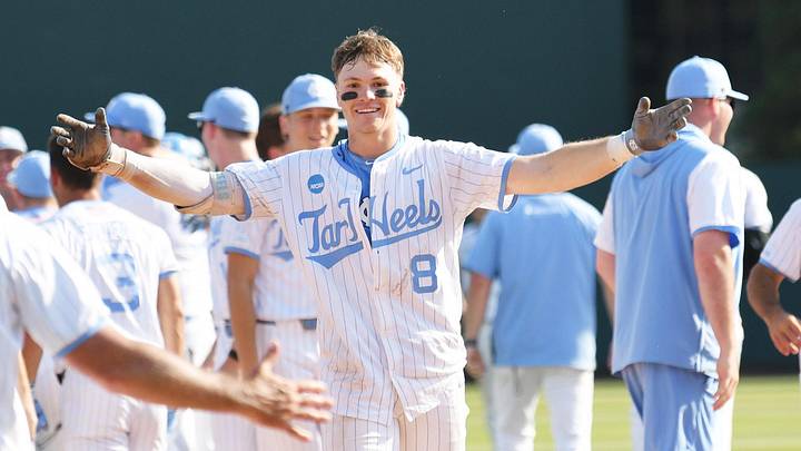 June 7, 2026; Chapel Hill, NC, USA;  North Carolina Tar Heels outfielder Owen Hull (8) celebrates with head coach Scott Forbes after his game winning hit against the USC Trojans at Boshamer Stadium. Mandatory Credit: Zachary Taft-Imagn Images