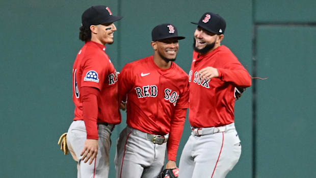 Boston Red Sox left fielder Jarren Duran, center fielder Ceddanne Rafaela and right fielder Wilyer Abreu celebrate a win