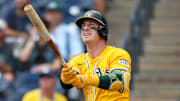 Athletics right fielder Brent Rooker (25) hits a home run against the Tampa Bay Rays in the first inning at George M. Steinbrenner Field.