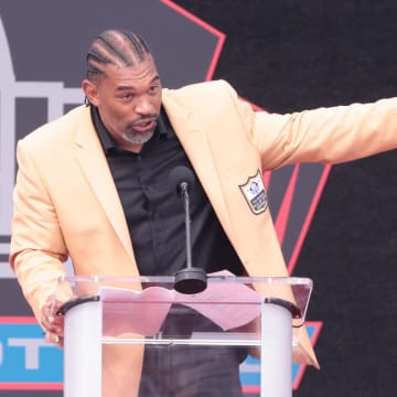 Julius Peppers gives his remarks at the 2024 Pro Football Hall of Fame Enshrinement at Tom Benson Hall of Fame Stadium Saturday, Aug. 3, 2024.