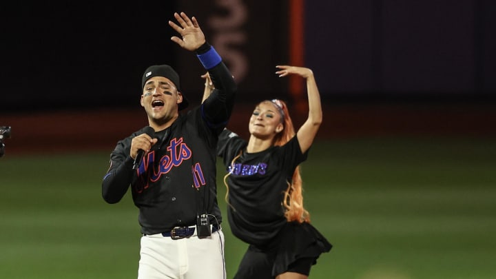 Jun 28, 2024; New York City, New York, USA;  New York Mets third baseman Jose Iglesias (11) performs after the Mets defeated the Houston Astros 7-2 at Citi Field. Mandatory Credit: Wendell Cruz-USA TODAY Sports