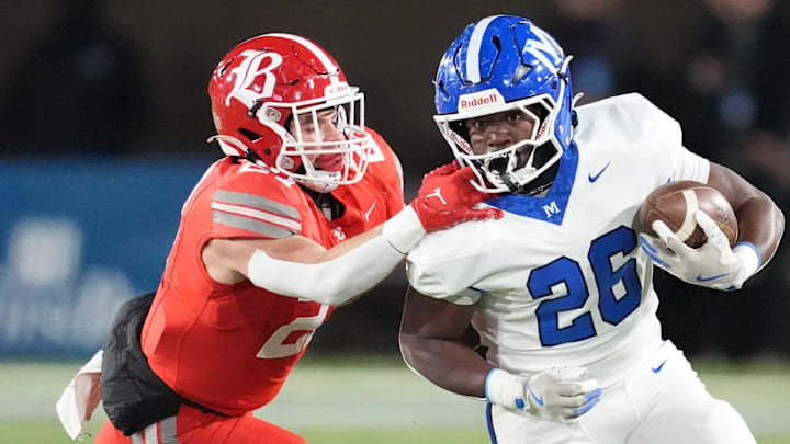 McCallie's Keylan Syam (26) is grabbed by Baylor's Chris Renegar (27).