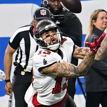 Jan 21, 2024; Detroit, Michigan, USA; Tampa Bay Buccaneers wide receiver Mike Evans (13) reaches for the ball against the Detroit Lions during the first half in a 2024 NFC divisional round game at Ford Field. Mandatory Credit: Lon Horwedel-Imagn Images