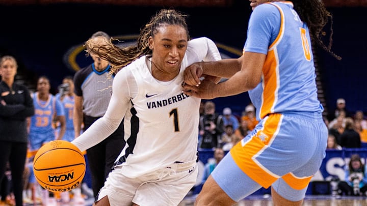 Vanderbilt Commodores guard Mikayla Blakes (1) drives on Tennessee Lady Vols guard Jewel Spear (0) during the second half at Bon Secours Wellness Arena. Vanderbilt Commodores guard Mikayla Blakes (1) drives on Tennessee Lady Vols guard Jewel Spear (0) during the second half at Bon Secours Wellness Arena.
