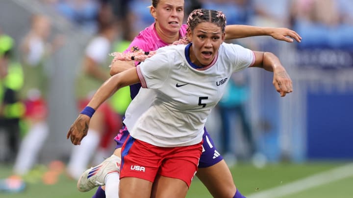 [US, Mexico & Canada customers only]  Aug 6, 2024; Decines-Charpieu, France; Trinity Rodman of the United States in action with Klara Buehl of Germany in a women's football semifinal match during the Paris 2024 Olympic Summer Games at Lyon Stadium. Mandatory Credit: Nir Elias/Reuters via USA TODAY Sports