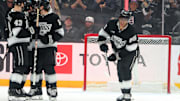 Apr 7, 2025; Los Angeles, California, USA;  Los Angeles Kings right wing Quinton Byfield (55, right) skates back to the bench after scoring a goal during the first period against the Seattle Kraken at Crypto.com Arena. Mandatory Credit: Kiyoshi Mio-Imagn Images
