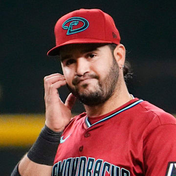 Arizona Diamondbacks third baseman Eugenio Suarez reacts after making a throwing error that allowed Atlanta Braves Matt Olson to score in the sixth inning at Chase Field in Phoenix, on Apr. 25, 2025.