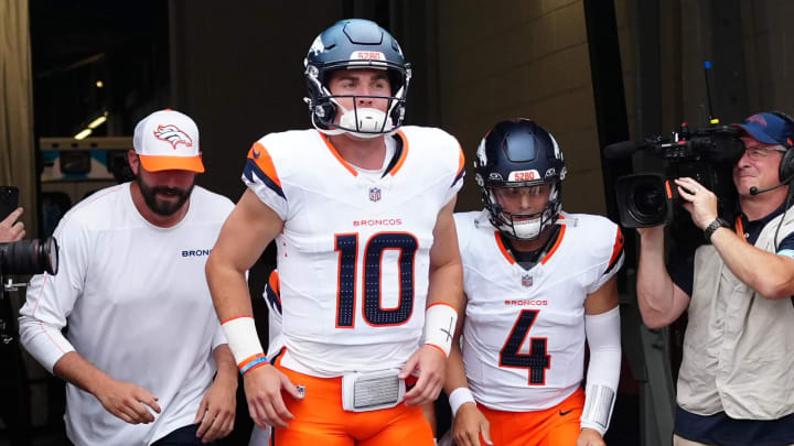 Aug 18, 2024; Denver, Colorado, USA; Denver Broncos quarterback Bo Nix (10) and quarterback Zach Wilson (4) before the preseason game against the Green Bay Packers at Empower Field at Mile High. 