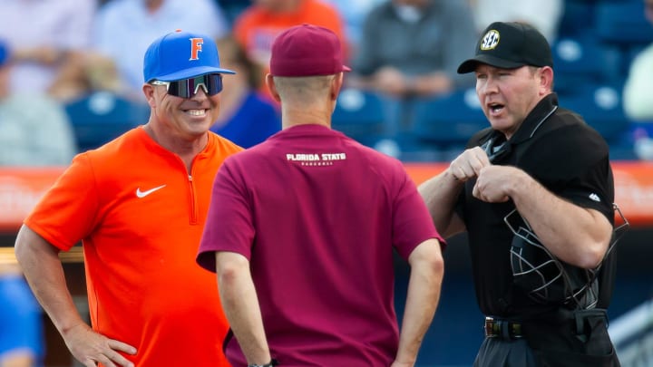 Florida Head Coach Kevin O'Sullivan talks with Florida State Head Coach Link Jarrett before the start of the game. The Florida Gators hosted Florida Sate Seminoles at Condron Ballpark in Gainesville, FL on Tuesday, March 12, 2024. Florida State defeated Florida 12-8. [Doug Engle/Gainesville Sun]