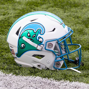 Dec 3, 2022; New Orleans, Louisiana, USA; Tulane Green Wave helmet on the field against the UCF Knights during the first half  at Yulman Stadium. Mandatory Credit: Stephen Lew-Imagn Images