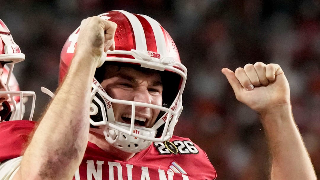 Indiana Hoosiers quarterback Fernando Mendoza (15) celebrates with his teammates after rushing for a touchdown Monday, Jan. 19, 2026, during the College Football Playoff National Championship college football game at Hard Rock Stadium in Miami Gardens.