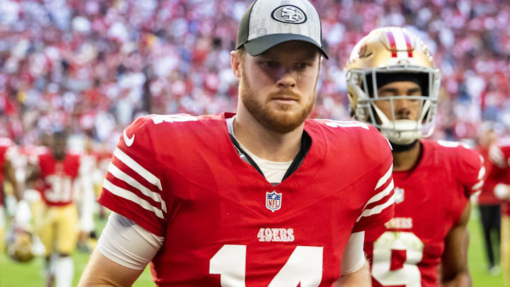Dec 17, 2023; Glendale, Arizona, USA; San Francisco 49ers quarterback Sam Darnold (14) against the Arizona Cardinals at State Farm Stadium. Mandatory Credit: Mark J. Rebilas-Imagn Images