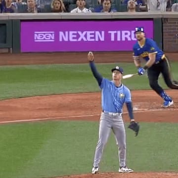 Griffin Jax pointed in the air after the ball sailed off Cal Raleigh's bat