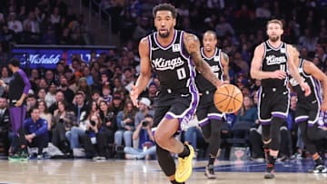 Jan 25, 2025; New York, New York, USA;  Sacramento Kings guard Malik Monk (0) brings the ball up court against the New York Knicks in the third quarter at Madison Square Garden. Mandatory Credit: Wendell Cruz-Imagn Images