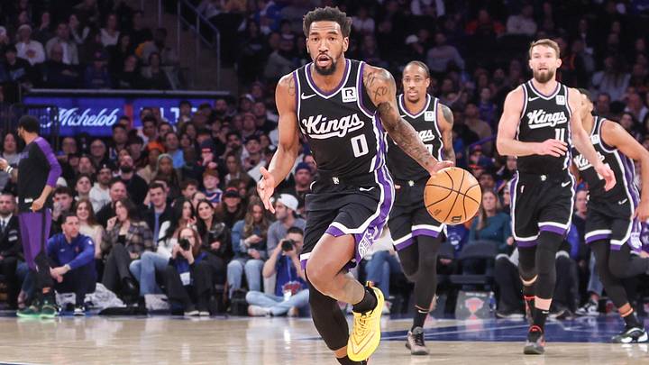 Jan 25, 2025; New York, New York, USA;  Sacramento Kings guard Malik Monk (0) brings the ball up court against the New York Knicks in the third quarter at Madison Square Garden. Mandatory Credit: Wendell Cruz-Imagn Images