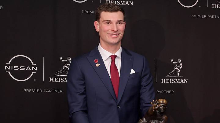 Dec 13, 2025; New York, NY, USA; Indiana Hoosiers quarterback Fernando Mendoza poses with the Heisman trophy during a press conference at the New York Marriott Marquis. Mandatory Credit: Brad Penner-Imagn Images