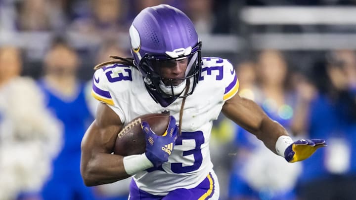 Jan 13, 2025; Glendale, AZ, USA; Minnesota Vikings running back Aaron Jones Sr. (33) against the Los Angeles Rams during an NFC wild card game at State Farm Stadium. Jan 13, 2025; Glendale, AZ, USA; Minnesota Vikings running back Aaron Jones Sr. (33) against the Los Angeles Rams during an NFC wild card game at State Farm Stadium.