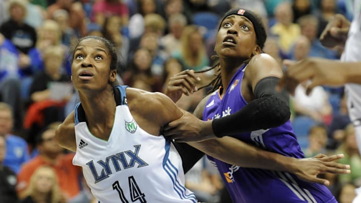 Jun 6, 2013; Minneapolis, MN, USA; Minnesota Lynx forward Devereaux Peters (14) and Phoenix Mercury forward Lynetta Kizer (12) battle for positioning in the fourth quarter at the Target Center. The Lynx defeated the Mercury 99-79.  Mandatory Credit: Marilyn Indahl-Imagn Images
