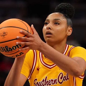 Mar 8, 2025; Indianapolis, IN, USA; South California Trojans guard JuJu Watkins (12) attempts a free throw against Michigan Wolverines during the second half of the Big Ten Conference Tournament semifinals at Gainbridge Fieldhouse. Mandatory Credit: Stephanie Amador Blondet-Imagn Images
