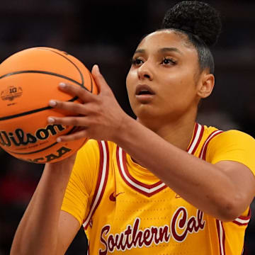 Mar 8, 2025; Indianapolis, IN, USA; South California Trojans guard JuJu Watkins (12) attempts a free throw against Michigan Wolverines during the second half of the Big Ten Conference Tournament semifinals at Gainbridge Fieldhouse.