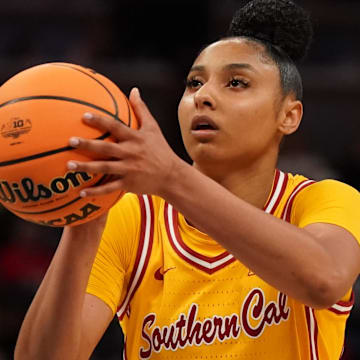 Mar 8, 2025; Indianapolis, IN, USA; South California Trojans guard JuJu Watkins (12) attempts a free throw against Michigan Wolverines during the second half of the Big Ten Conference Tournament semifinals at Gainbridge Fieldhouse.