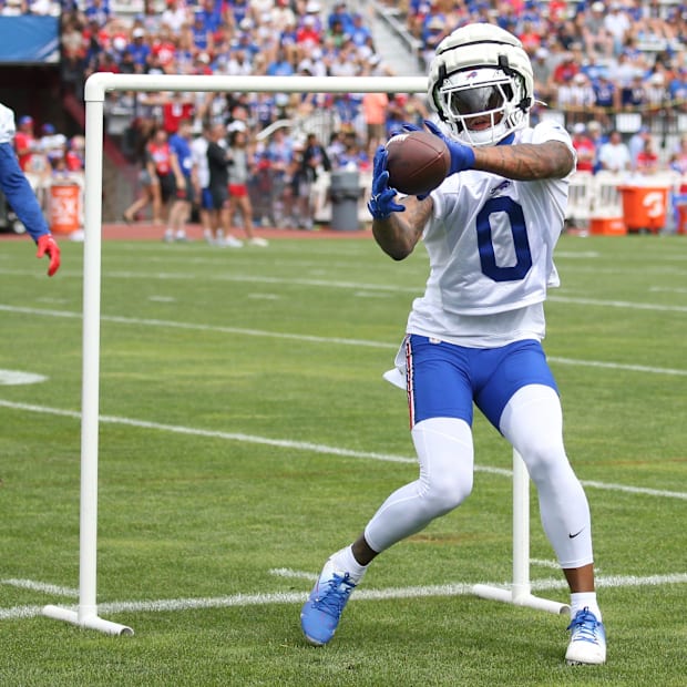 Keon Coleman pulls in a pass during position drills