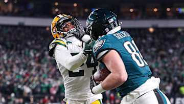 Jan 12, 2025; Philadelphia, Pennsylvania, USA; Philadelphia Eagles tight end Dallas Goedert (88) runs with the ball against Green Bay Packers cornerback Carrington Valentine (24) after a catch in an NFC wild card game at Lincoln Financial Field. Mandatory Credit: Bill Streicher-Imagn Images