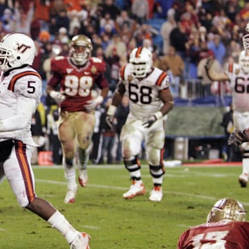 Dec 4, 2010; Charlotte, NC, USA; Virginia Tech quarterback Tyrod Taylor (5) jogs into the end zone for a 5-yard touchdown run in the fourth quarter of the 2010 ACC Championship game at Bank of America Stadium.  Virginia Tech won 44-33.